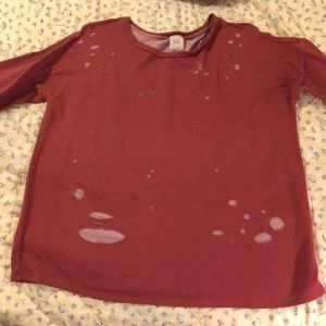 quarter sleeve burgundy shredded shirt.